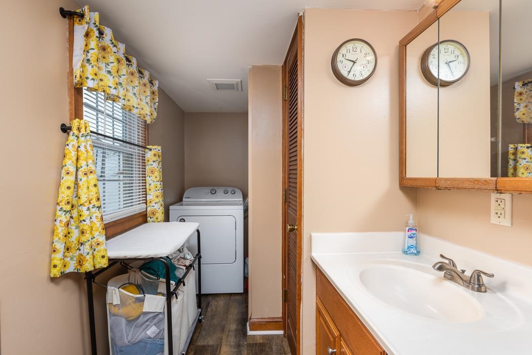 588 Concord Church Road Timberville, VA 22853 - Photo 21 of 32 a bathroom with a sink a mirror and a toilet