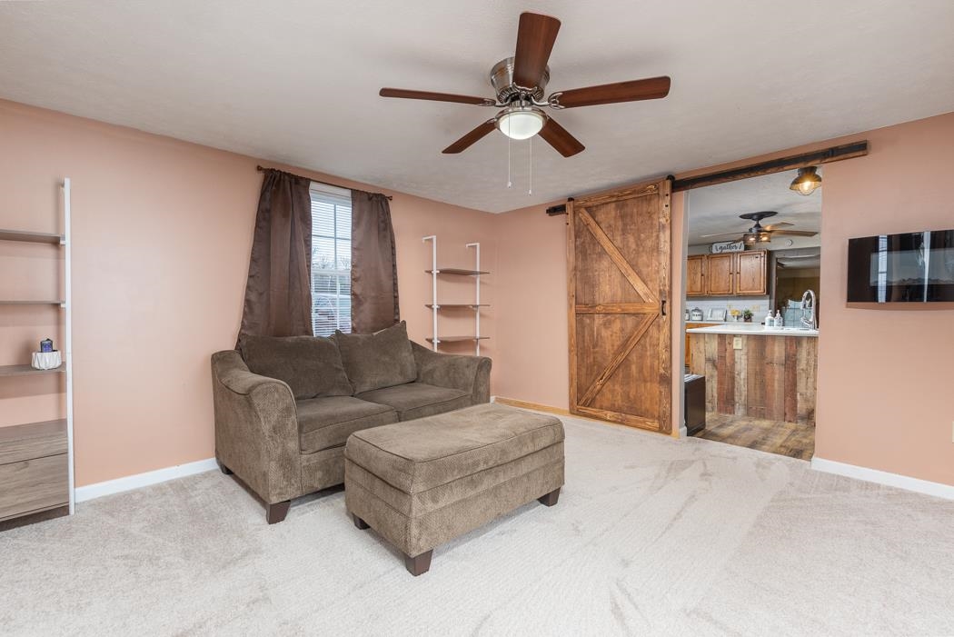 588 Concord Church Road Timberville, VA 22853 - Photo 24 of 32 a living room with furniture and a ceiling fan