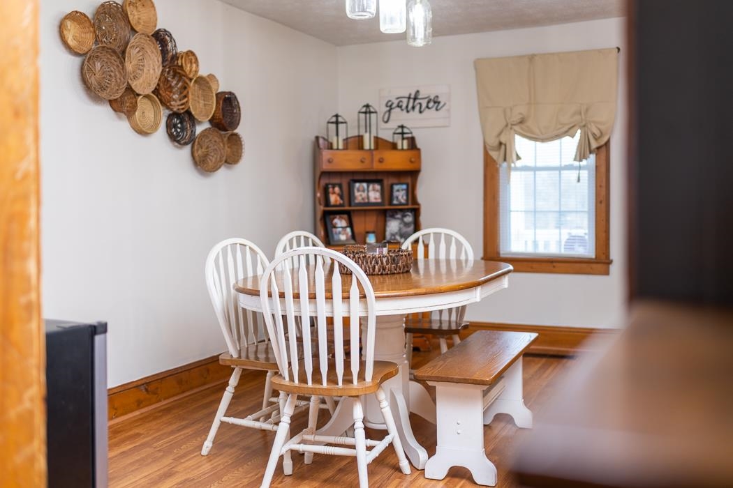 588 Concord Church Road Timberville, VA 22853 - Photo 7 of 32 a view of a dining room with furniture a chandelier and wooden floor