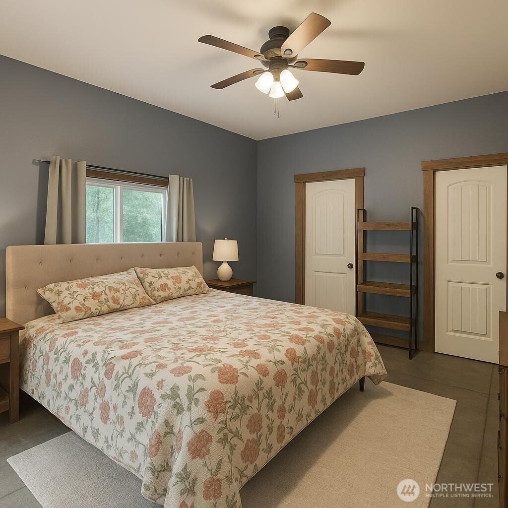 3324 Bailey Way Ferndale, WA 98248 - Photo 11 of 23 a bedroom with a large bed and a chandelier