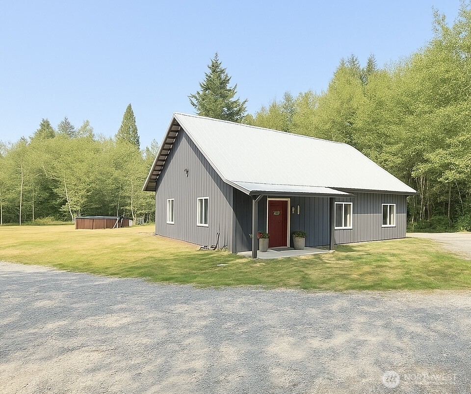3324 Bailey Way Ferndale, WA 98248 - Photo 2 of 23 a house with trees in front of it