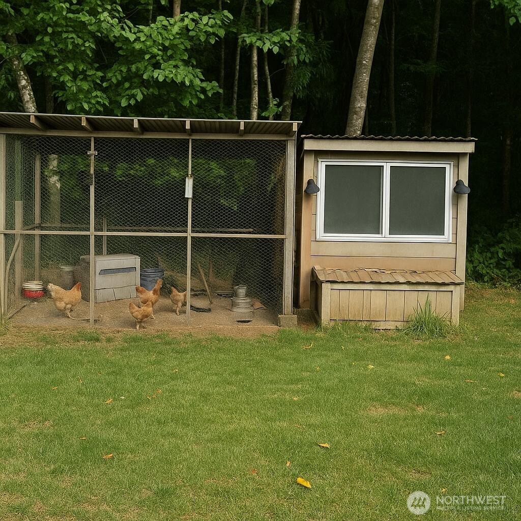 3324 Bailey Way Ferndale, WA 98248 - Photo 22 of 23 a backyard of a house with table and chairs