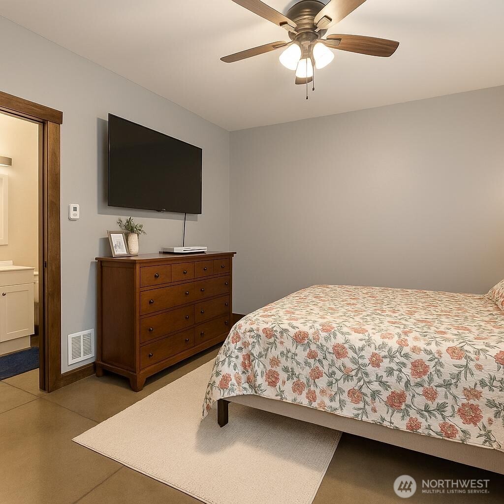 3324 Bailey Way Ferndale, WA 98248 - Photo 9 of 23 a bedroom with a bed and a flat screen tv