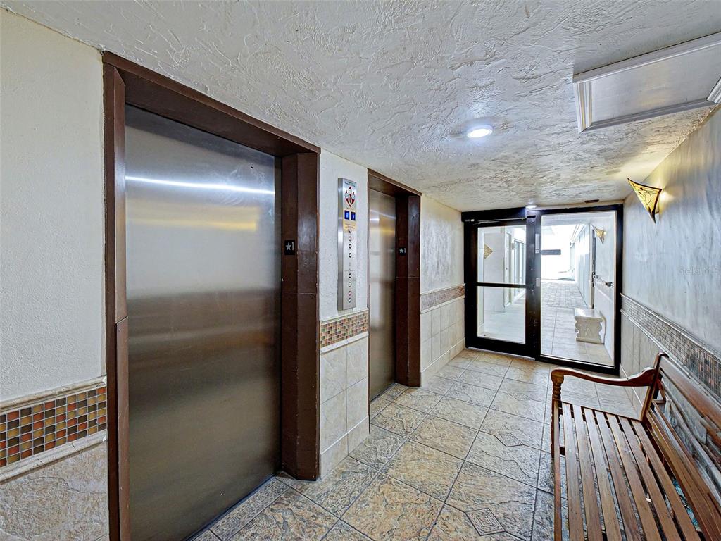 633 Alhambra Road, Unit 1006 Venice, FL 34285 - Photo 55 of 55 a view of a hallway with wooden shelves