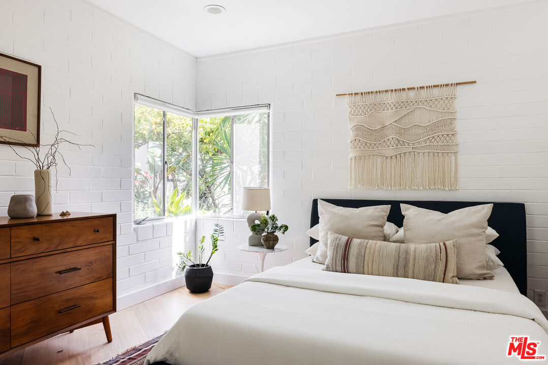811 Montecito Drive Los Angeles, CA 90031 - Photo 14 of 25 a bedroom with a bed and a flat tv screen