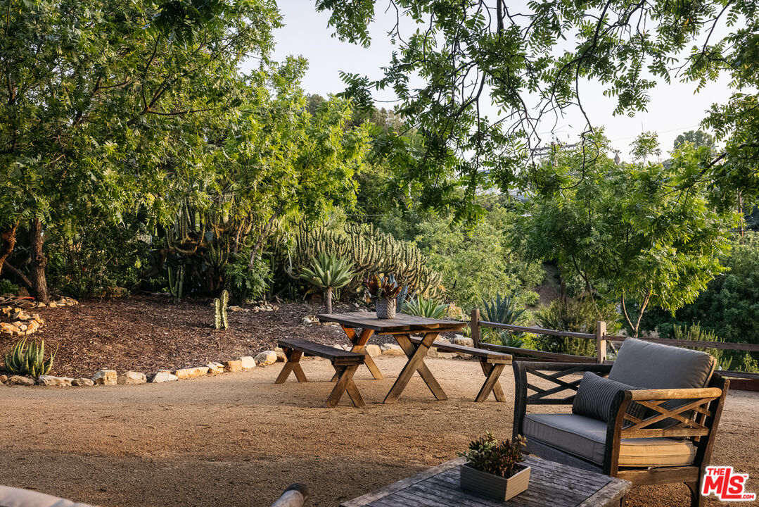 811 Montecito Drive Los Angeles, CA 90031 - Photo 24 of 25 a view of a chairs and table in the backyard