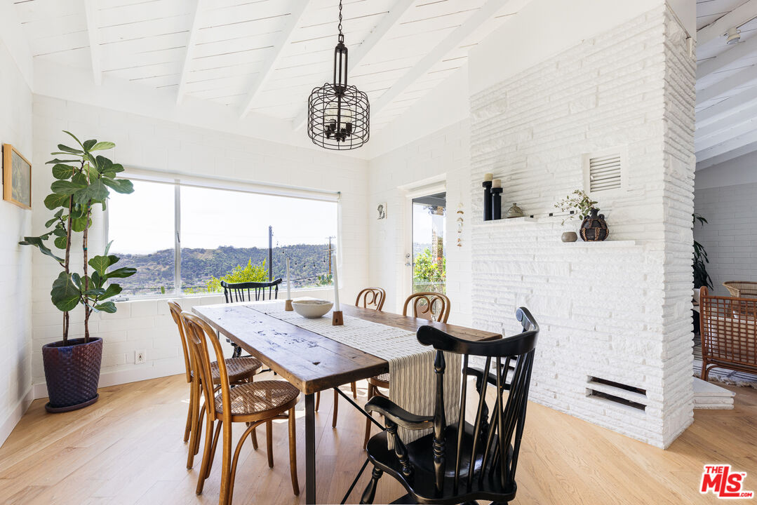 811 Montecito Drive Los Angeles, CA 90031 - Photo 8 of 25 a view of a dining room with furniture window and wooden floor