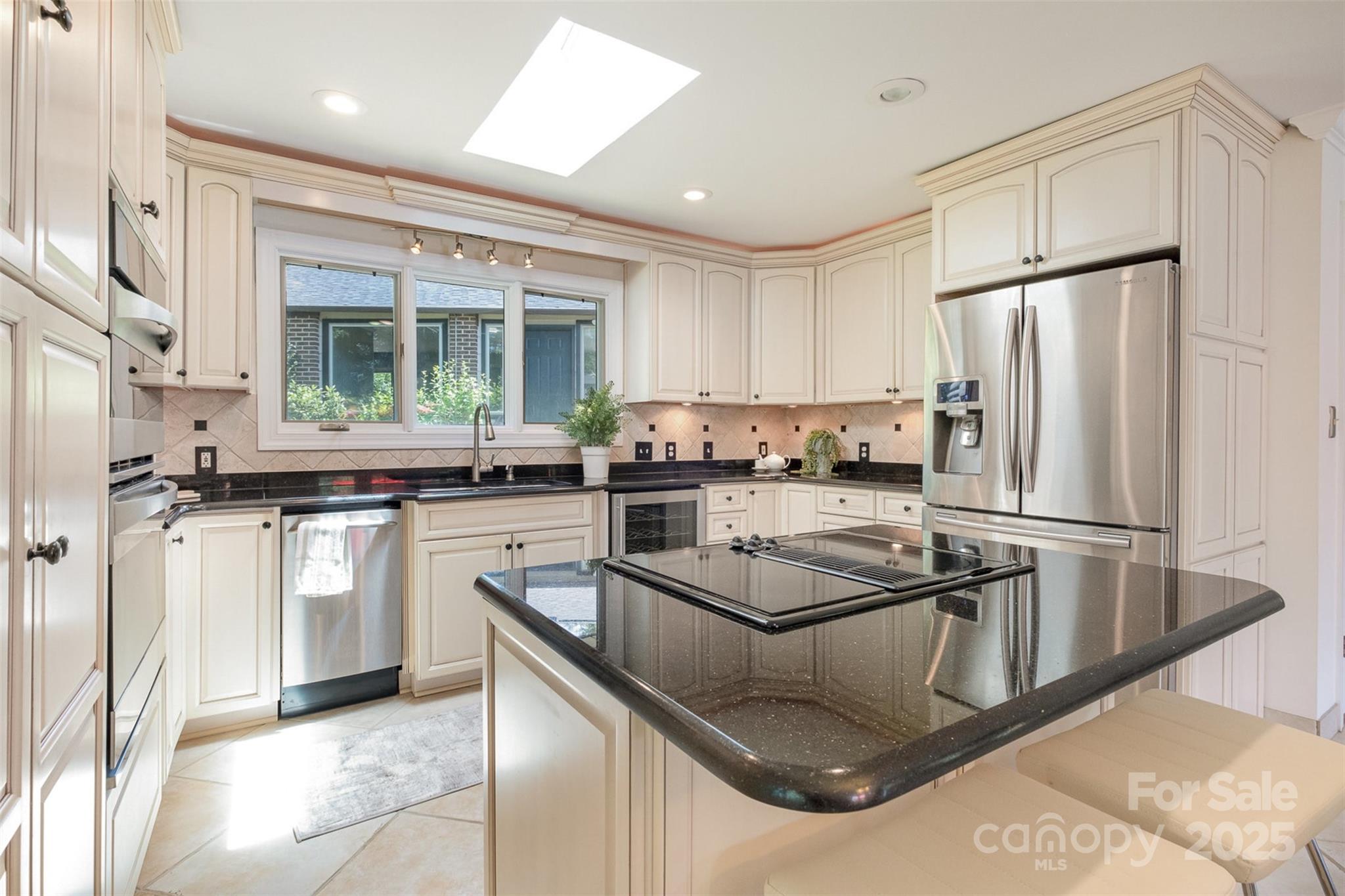 9500 Windygap Road Charlotte, NC 28278 - Photo 12 of 48 a kitchen with stainless steel appliances granite countertop a refrigerator a sink a stove and white cabinets
