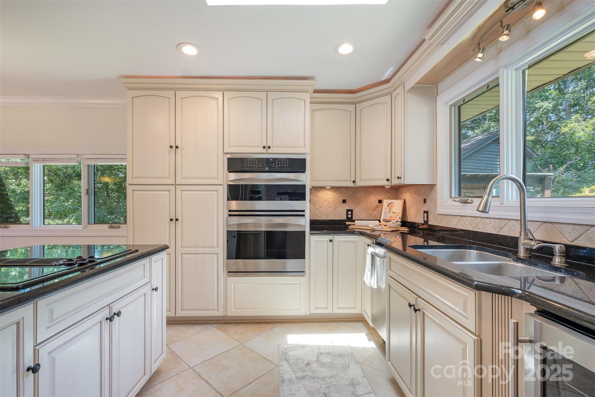 9500 Windygap Road Charlotte, NC 28278 - Photo 13 of 48 a kitchen with granite countertop a sink stainless steel appliances and cabinets