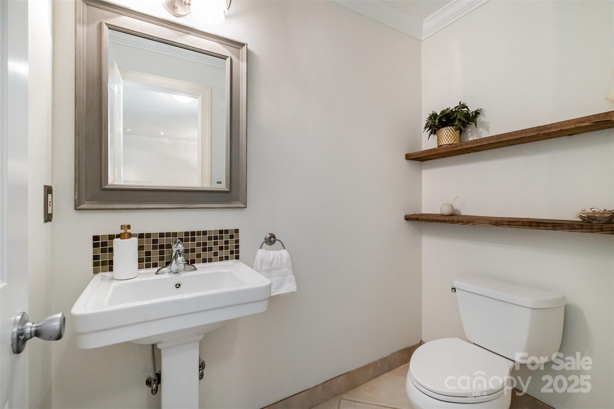 9500 Windygap Road Charlotte, NC 28278 - Photo 14 of 48 a bathroom with a toilet sink and mirror