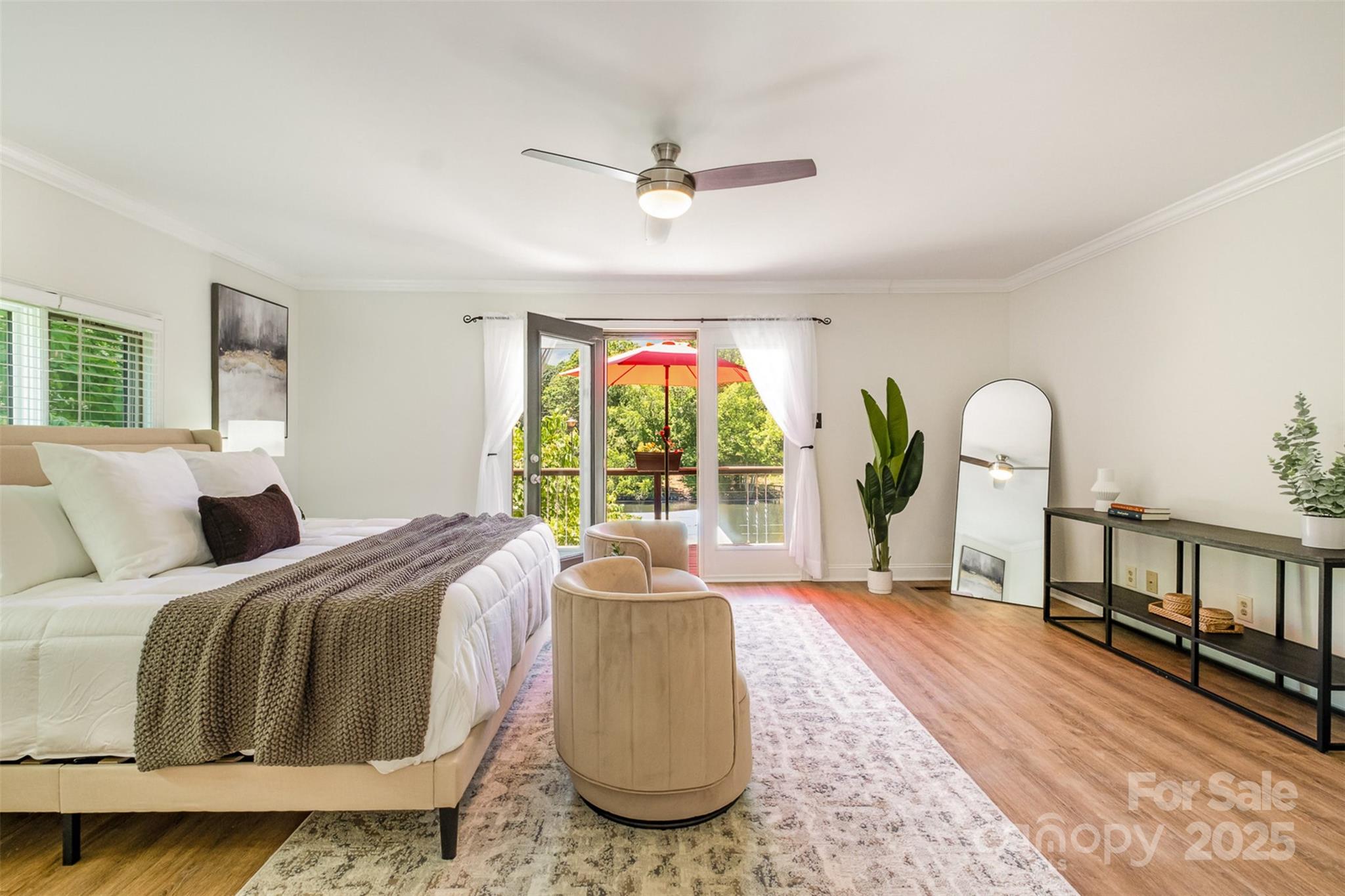 9500 Windygap Road Charlotte, NC 28278 - Photo 17 of 48 a bedroom with a bed next to a large window with outer view