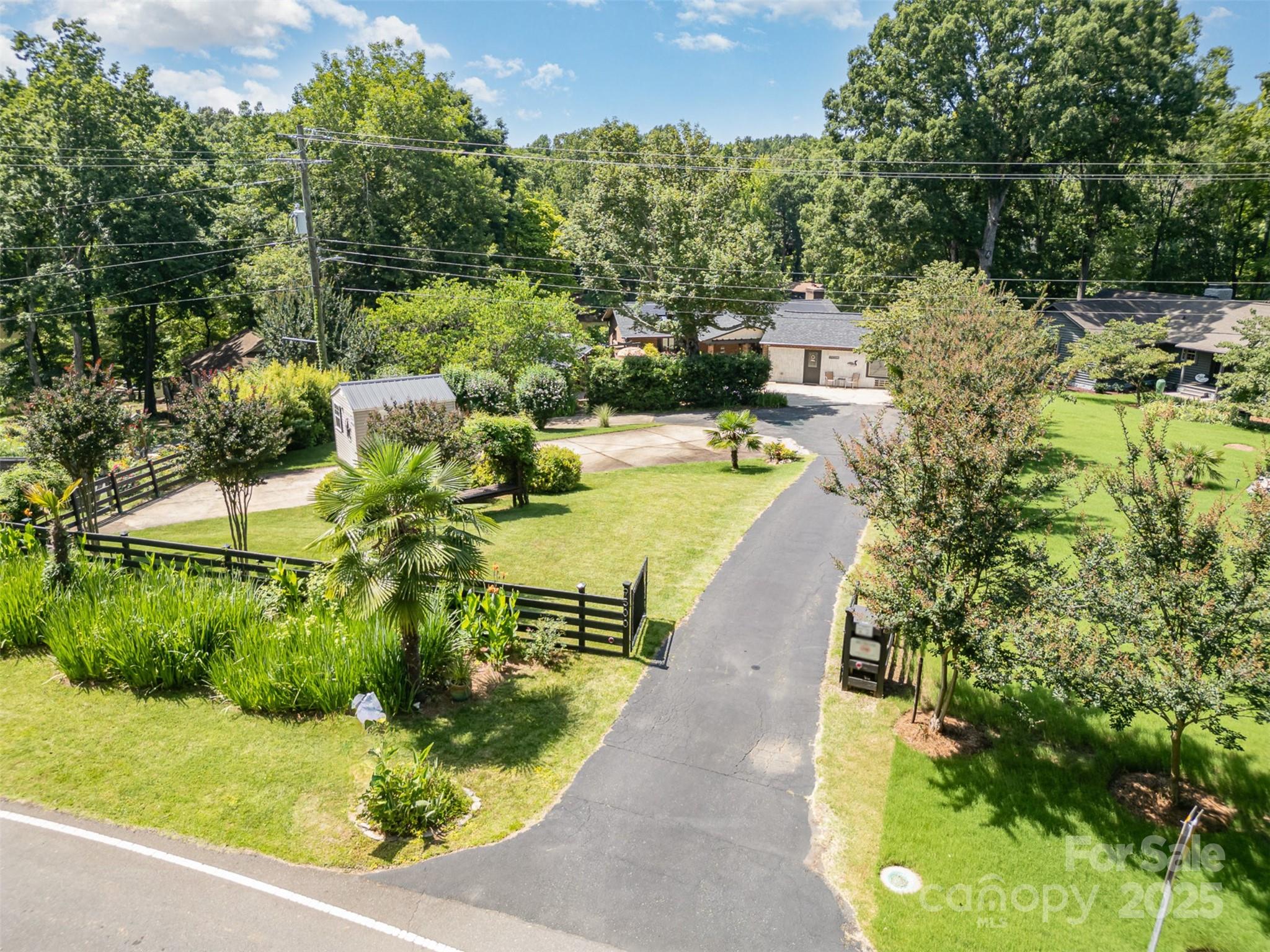 9500 Windygap Road Charlotte, NC 28278 - Photo 2 of 48 a view of a swimming pool with a yard