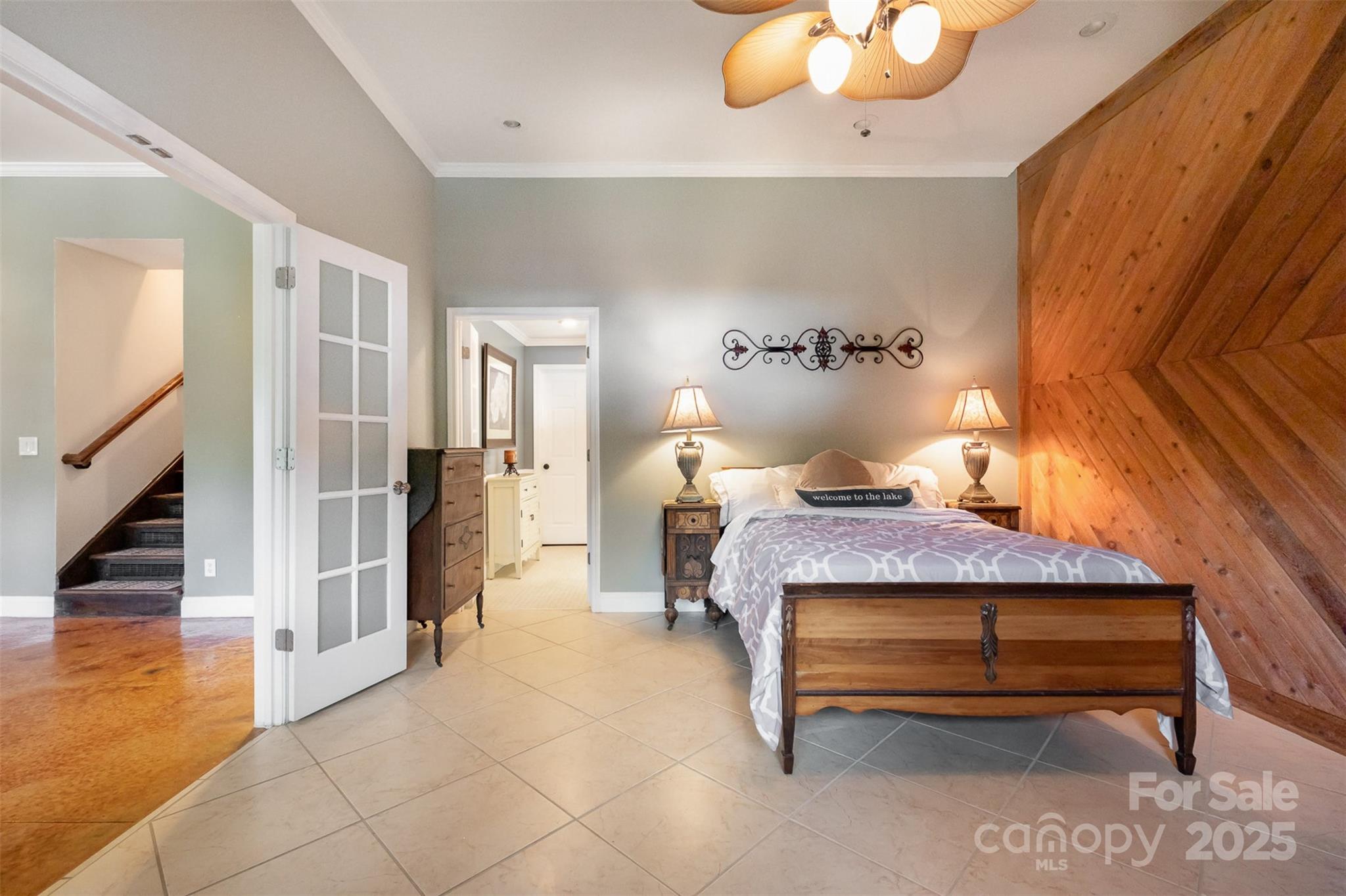 9500 Windygap Road Charlotte, NC 28278 - Photo 29 of 48 a bedroom with furniture and a chandelier