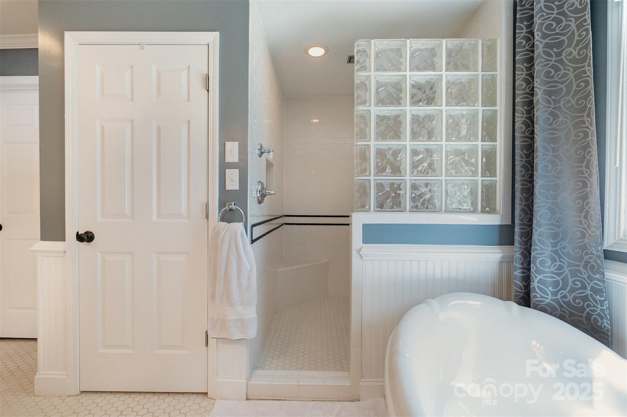 9500 Windygap Road Charlotte, NC 28278 - Photo 31 of 48 a bathroom with a tub and shower