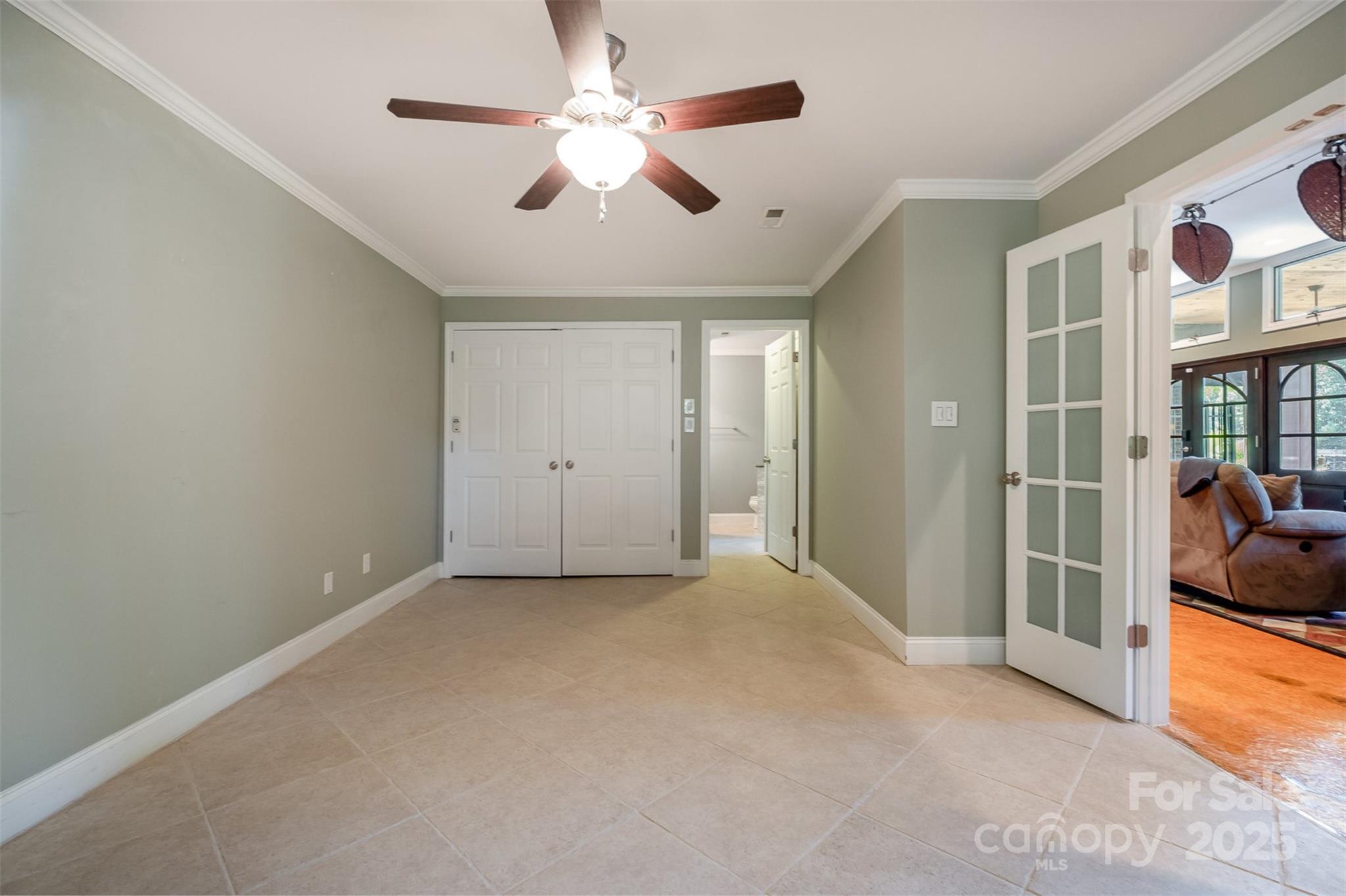 9500 Windygap Road Charlotte, NC 28278 - Photo 32 of 48 en empty room with windows and fan