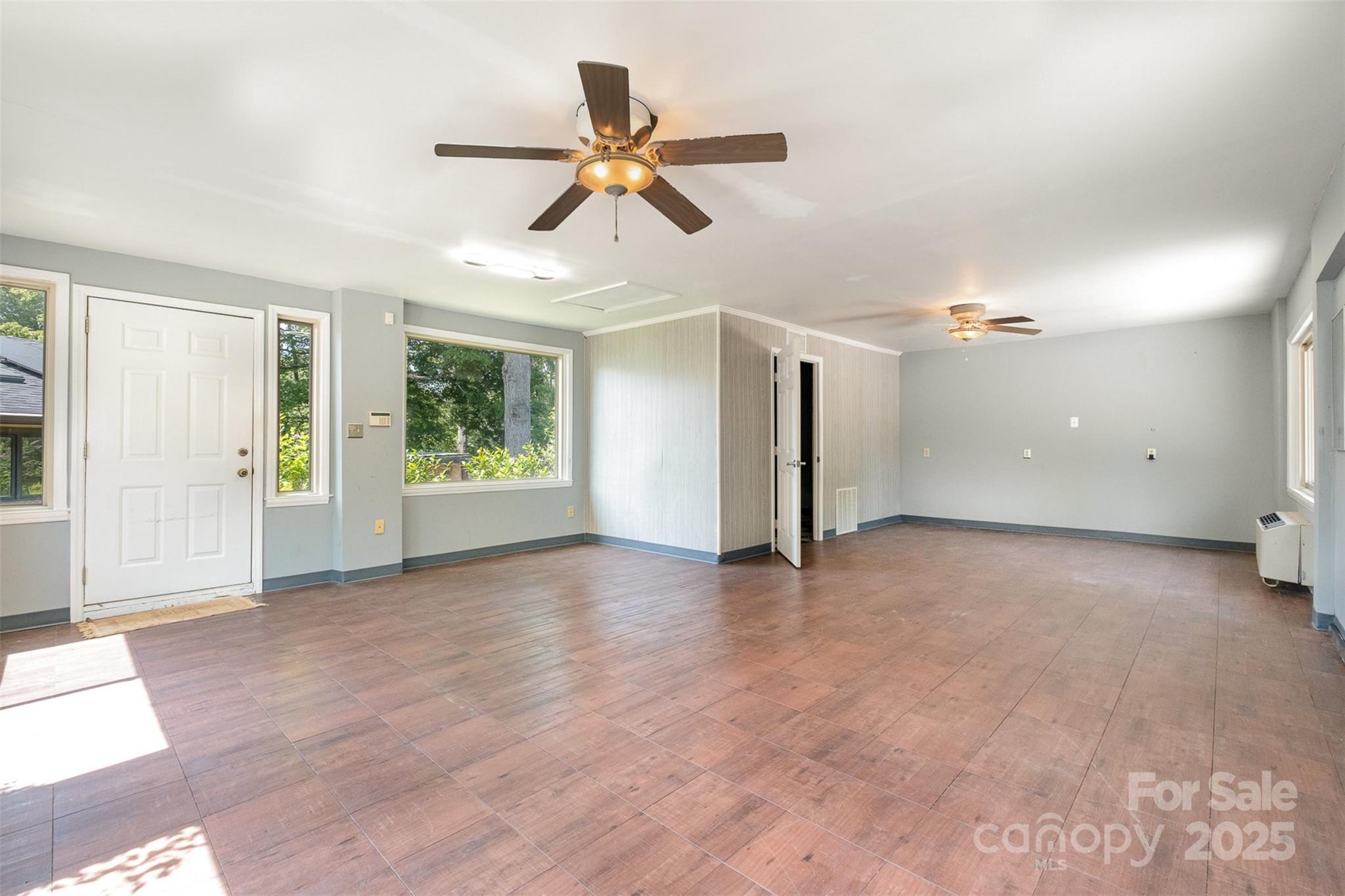 9500 Windygap Road Charlotte, NC 28278 - Photo 34 of 48 a view of an empty room with window and wooden floor