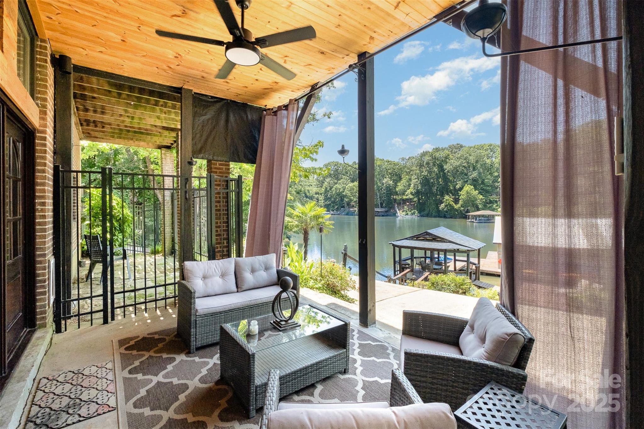9500 Windygap Road Charlotte, NC 28278 - Photo 35 of 48 a living room with furniture and a floor to ceiling window