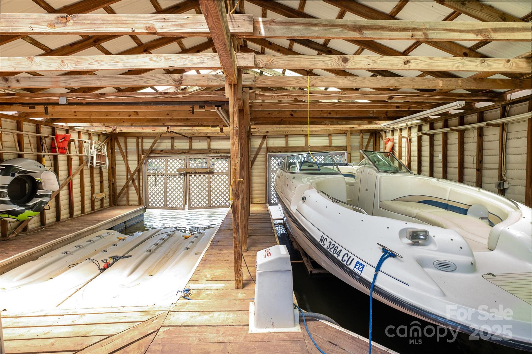 9500 Windygap Road Charlotte, NC 28278 - Photo 38 of 48 a view of a patio with a table and chairs