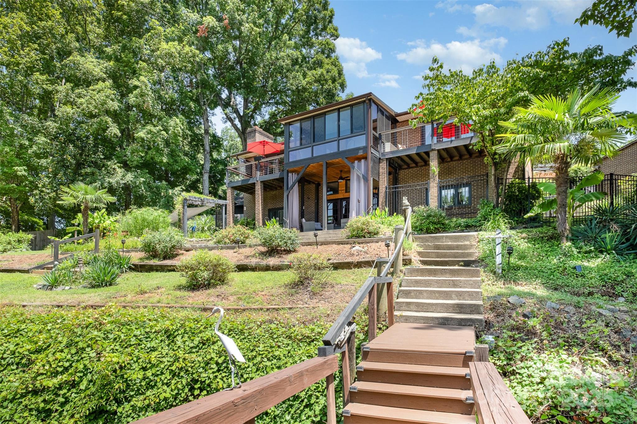 9500 Windygap Road Charlotte, NC 28278 - Photo 43 of 48 a view of a house with fountain and plants