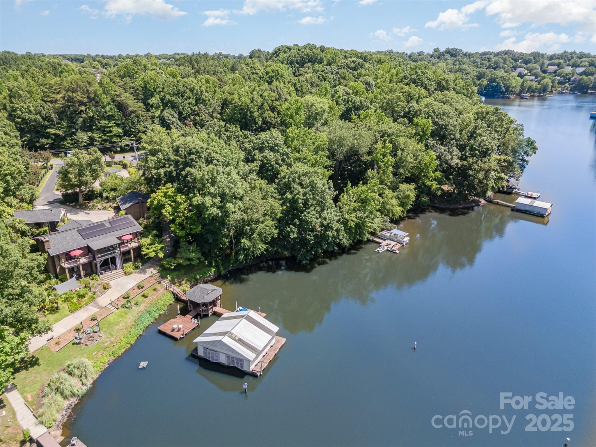 9500 Windygap Road Charlotte, NC 28278 - Photo 45 of 48 an aerial view of a house with garden space and lake view
