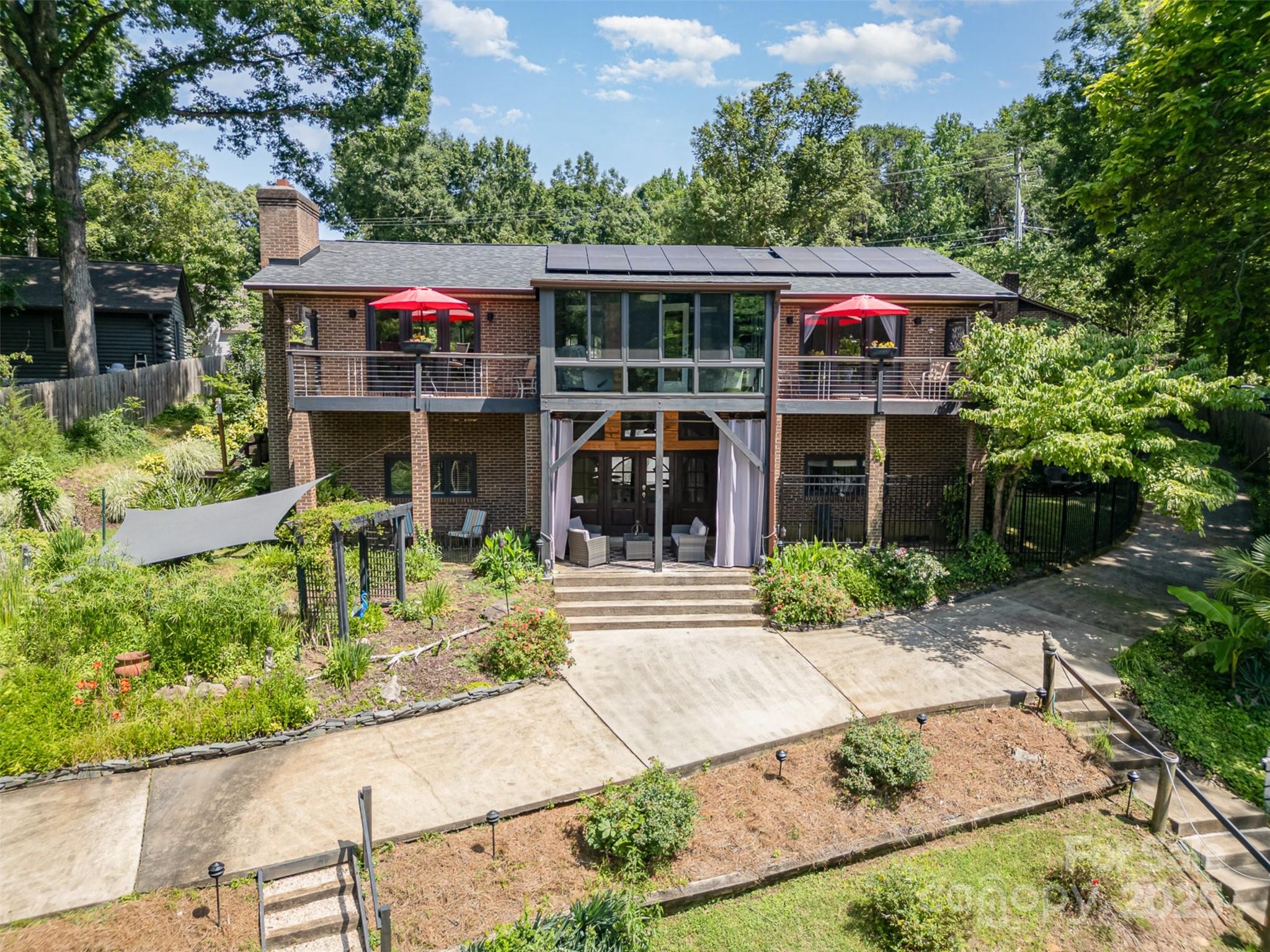 9500 Windygap Road Charlotte, NC 28278 - Photo 47 of 48 a front view of a house with garden
