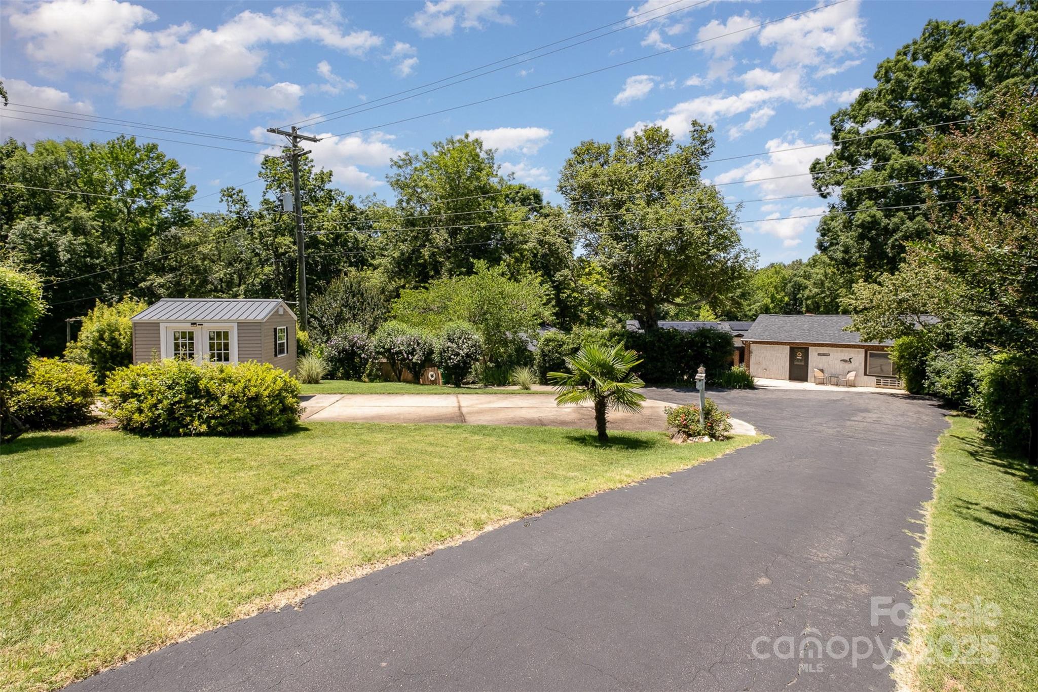 9500 Windygap Road Charlotte, NC 28278 - Photo 48 of 48 a front view of a house with garden and trees