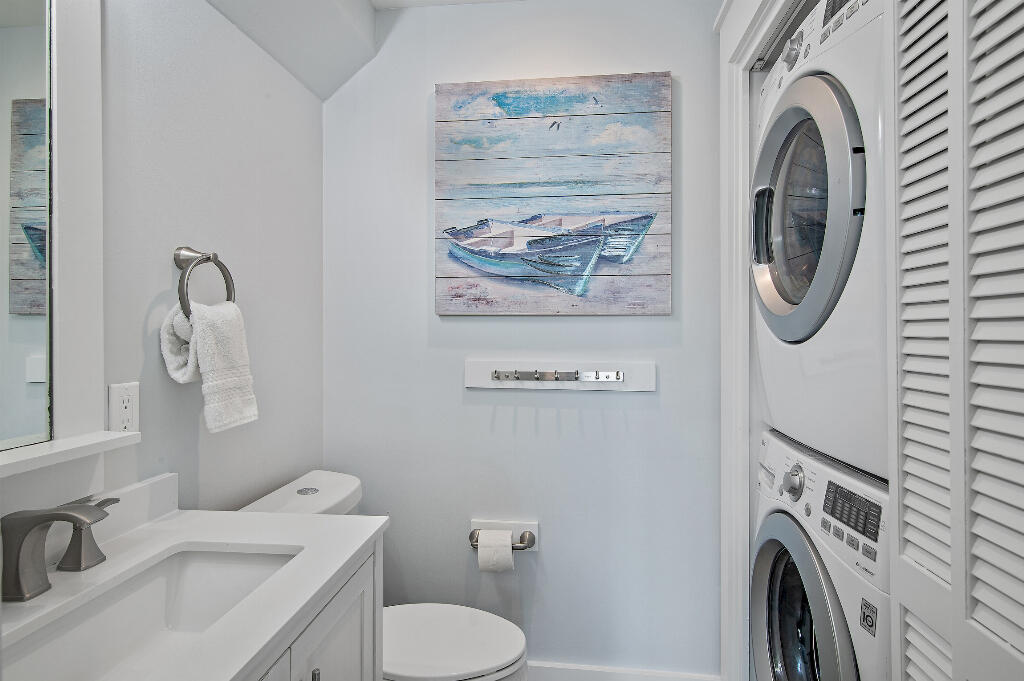 198 Somerset Bridge Road, Unit 123 Santa Rosa Beach, FL 32459 - Photo 11 of 21 a bathroom with a sink a washer and dryer