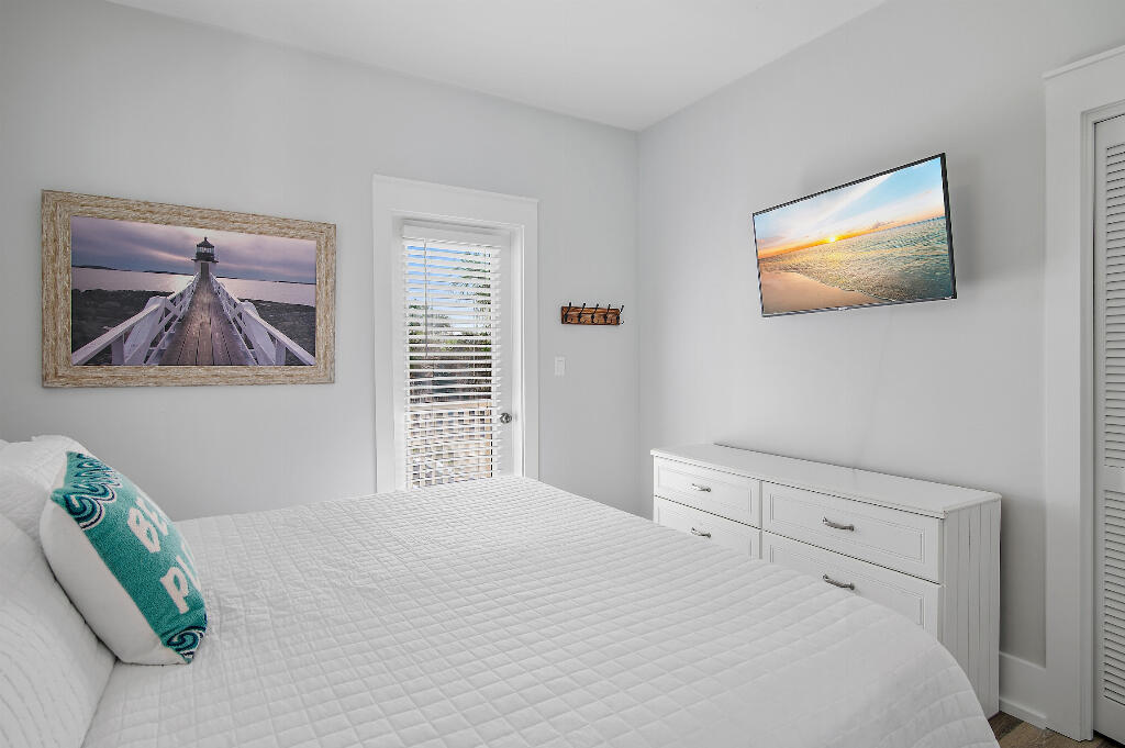 198 Somerset Bridge Road, Unit 123 Santa Rosa Beach, FL 32459 - Photo 13 of 21 a bedroom with a bed and a painting on the wall