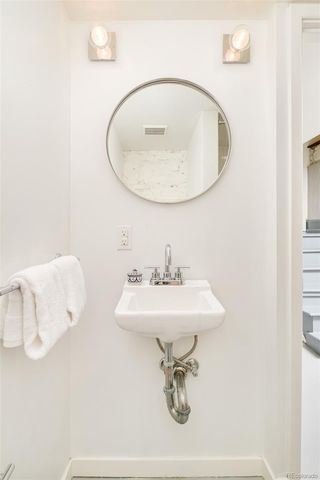 a bathroom with a sink a mirror and vanity