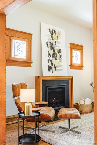 a bedroom with furniture and a fireplace