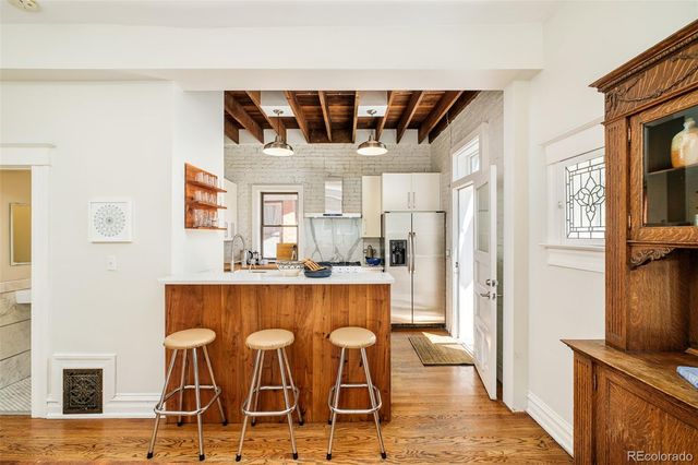a kitchen with a table and chairs in it