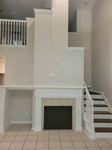 a view of an empty room with a fireplace