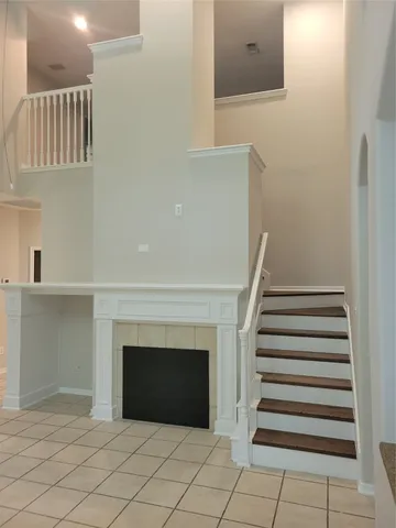 a view of a livingroom with entryway and hallway