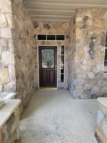 a view of empty room with a fireplace