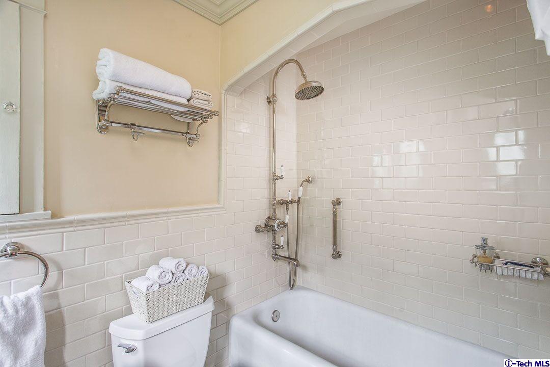 1911 Pepper Drive Altadena, CA 91001 - Photo 14 of 28 a bathroom with a tub a toilet and a shower