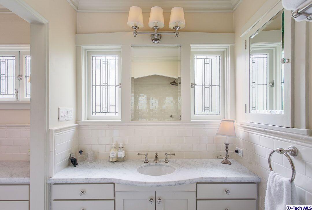 1911 Pepper Drive Altadena, CA 91001 - Photo 15 of 28 a bathroom with a sink and a mirror