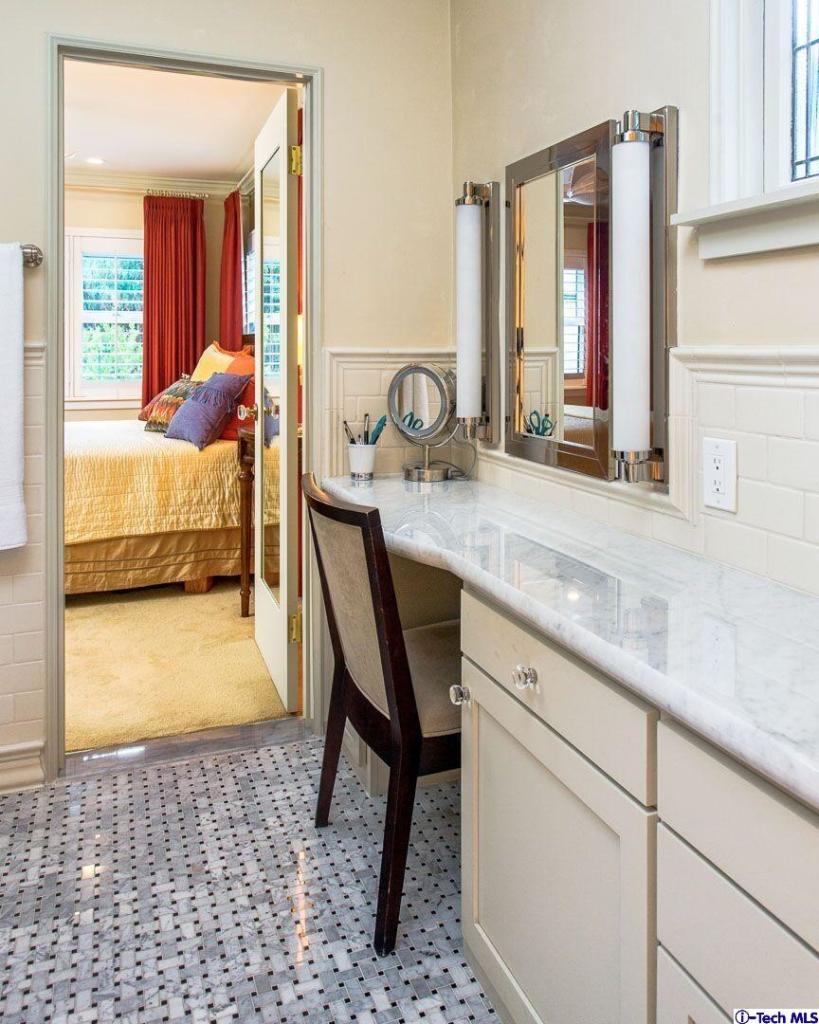 1911 Pepper Drive Altadena, CA 91001 - Photo 16 of 28 a en suite bathroom with a granite countertop sink and a mirror