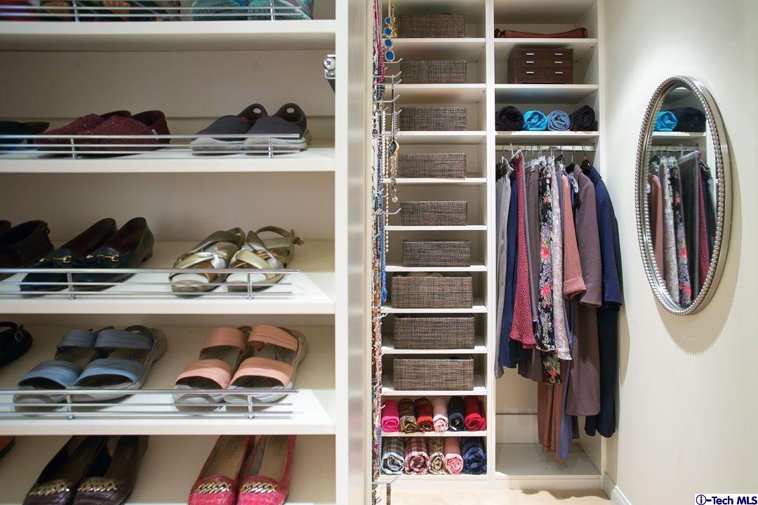 1911 Pepper Drive Altadena, CA 91001 - Photo 18 of 28 a view of walk in closet with clothes and shoes