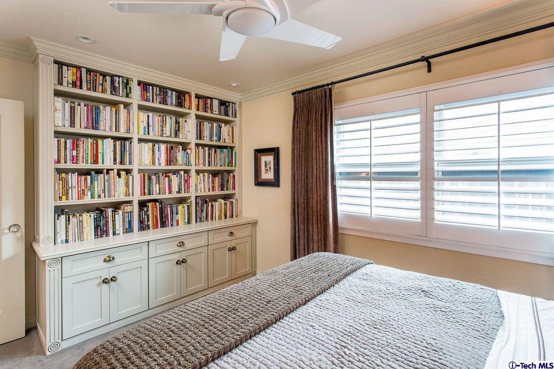 1911 Pepper Drive Altadena, CA 91001 - Photo 21 of 28 a bedroom with a bookshelf and a window