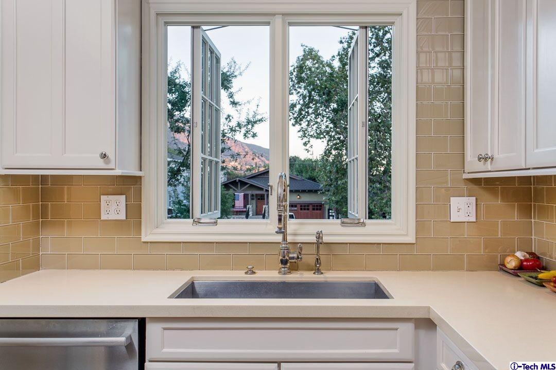 1911 Pepper Drive Altadena, CA 91001 - Photo 10 of 28 a bathroom with a sink and a bathtub next to a window