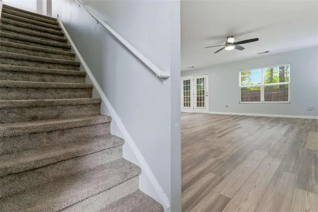 a view of entryway and hall with wooden floor