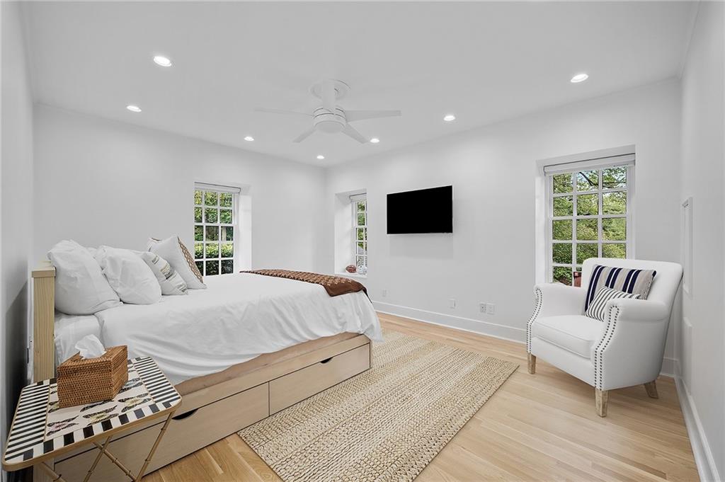 898 Persimmon Road Sewickley, PA 15143 - Photo 36 of 50 This auxiliary bedroom overlooks the great lawn and is flooded with natural light. It features a walk-in closet and white tiled bathroom.