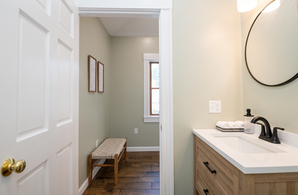 179 Lions Mouth Road Amesbury, MA 01913 - Photo 12 of 42 a bathroom with a sink and a mirror