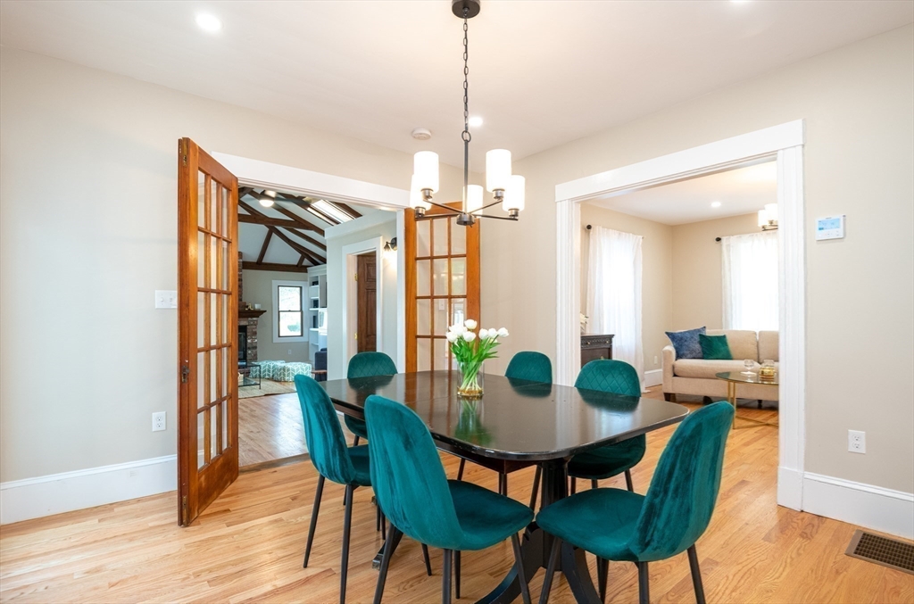 179 Lions Mouth Road Amesbury, MA 01913 - Photo 13 of 42 a dining room with furniture and wooden floor
