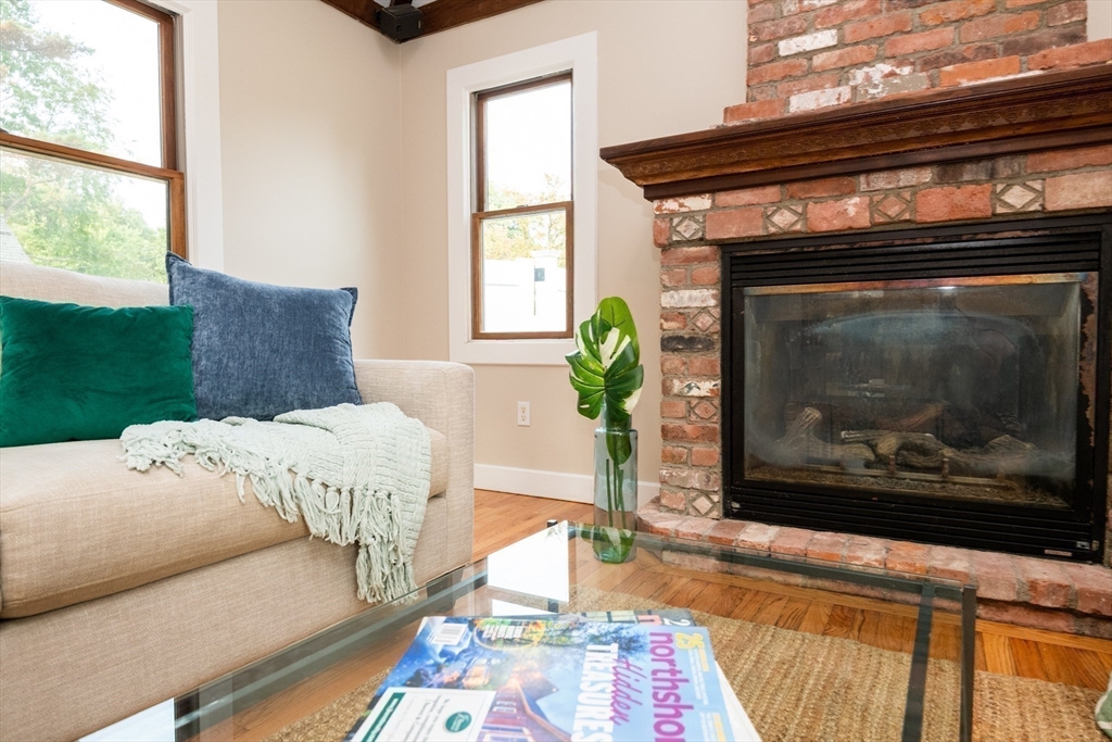 179 Lions Mouth Road Amesbury, MA 01913 - Photo 17 of 42 a living room with furniture and a fireplace