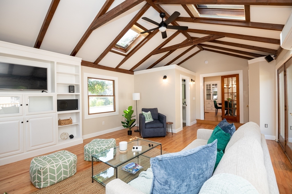 179 Lions Mouth Road Amesbury, MA 01913 - Photo 18 of 42 a living room with furniture and a flat screen tv