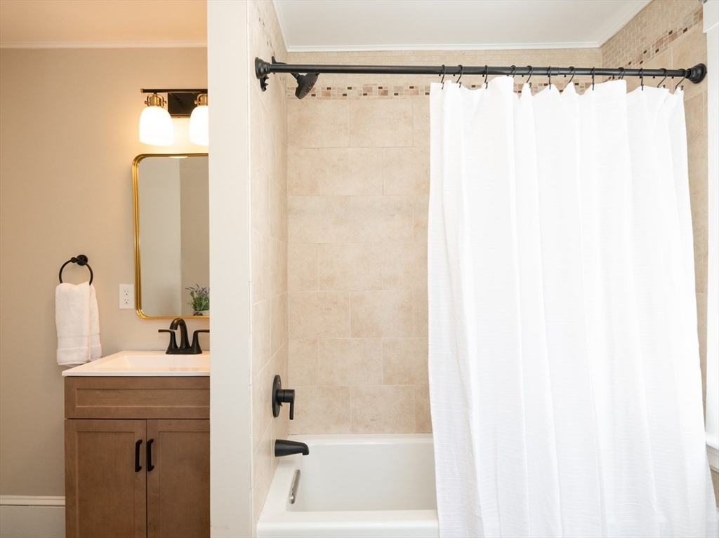 179 Lions Mouth Road Amesbury, MA 01913 - Photo 35 of 42 a bathroom with a shower and a sink