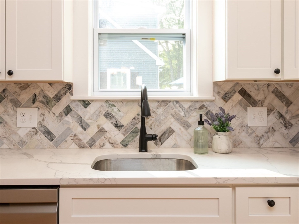 179 Lions Mouth Road Amesbury, MA 01913 - Photo 6 of 42 a bathroom with a sink and a window