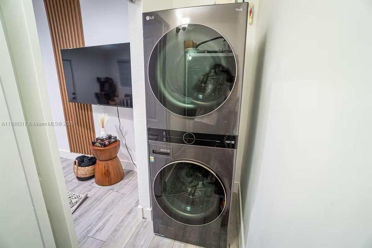 271 Northwest 143rd Street Miami, FL 33168 - Photo 17 of 43 a utility room with a sink dryer and washer