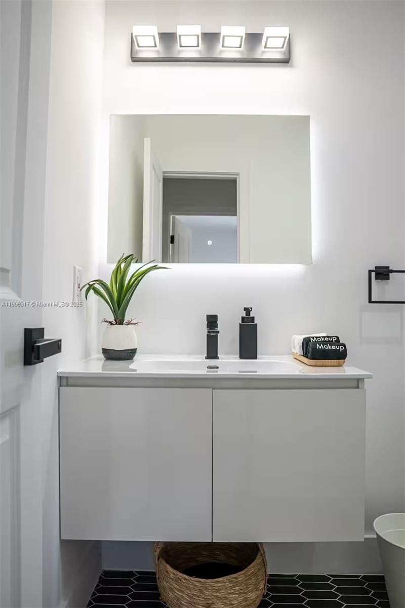 271 Northwest 143rd Street Miami, FL 33168 - Photo 21 of 43 a kitchen with a sink a stove and cabinets